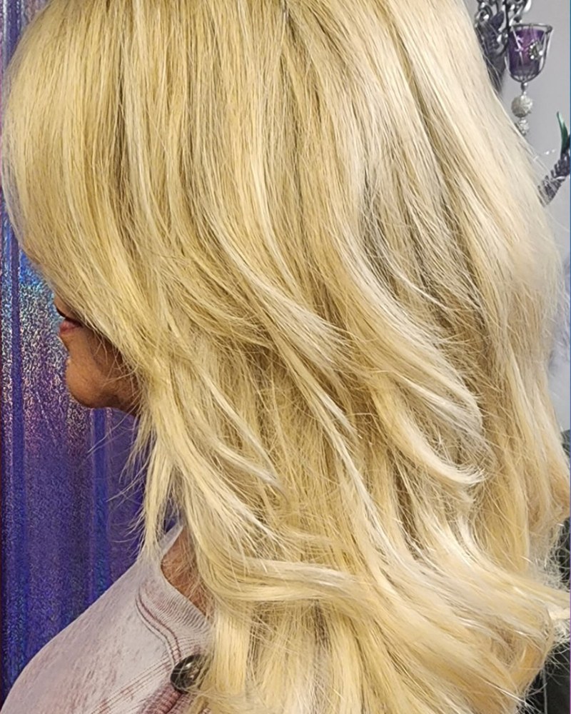 Voluminous blonde hair after extension installation